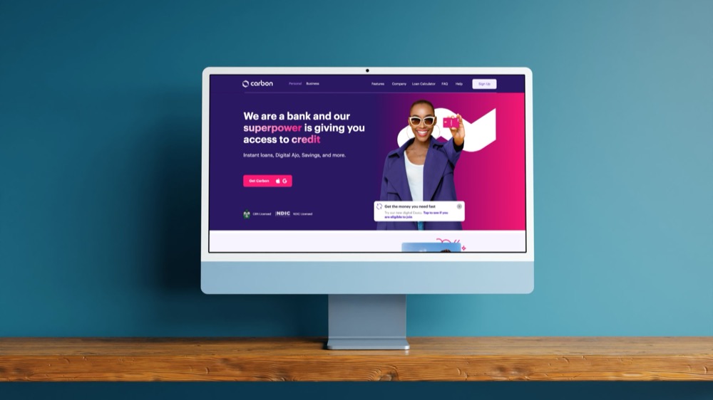 The Carbon website, a pan-African digital bank, shown on a desktop monitor